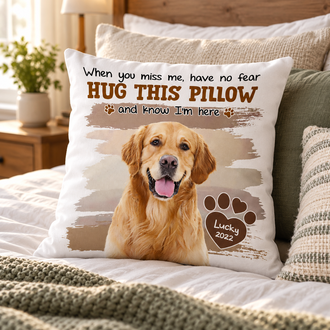 Personalized pet photo memorial pillow on a made bed in soft morning light