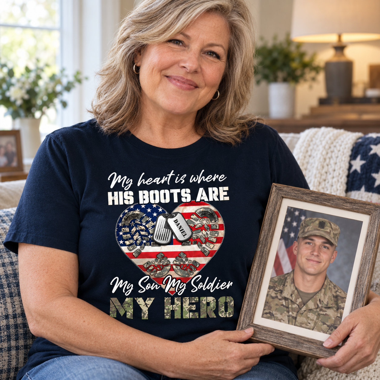 Mother in a personalized My Heart Is Where His Boots Are soldier shirt holding her son's photo