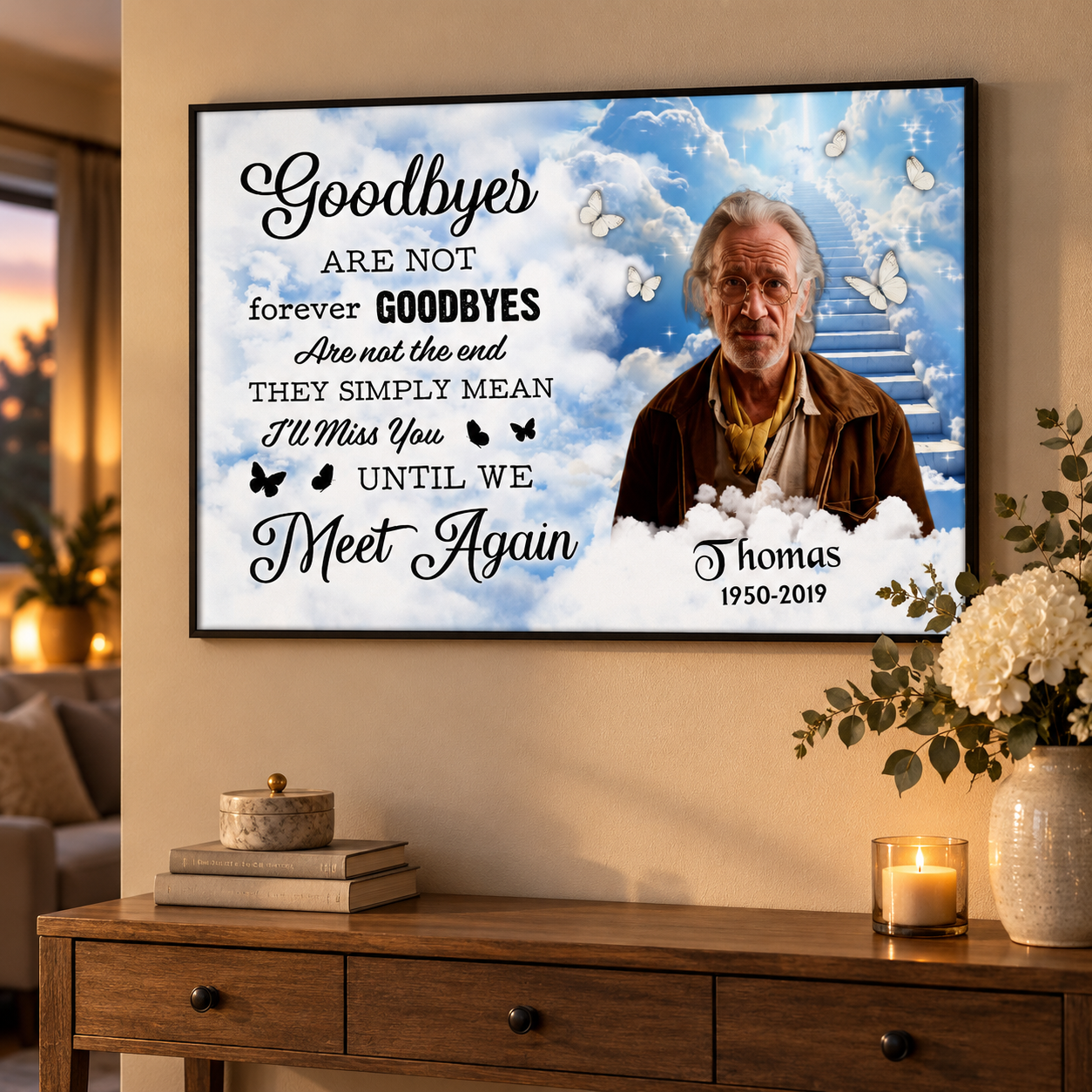 Personalized memorial canvas print with photo and poem hung above a console table with flowers