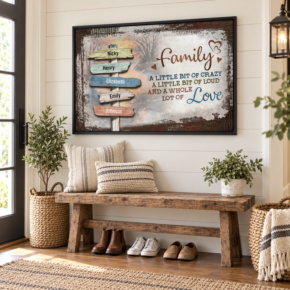 Personalized Family a little bit of crazy name signpost poster in a black frame above an entryway bench