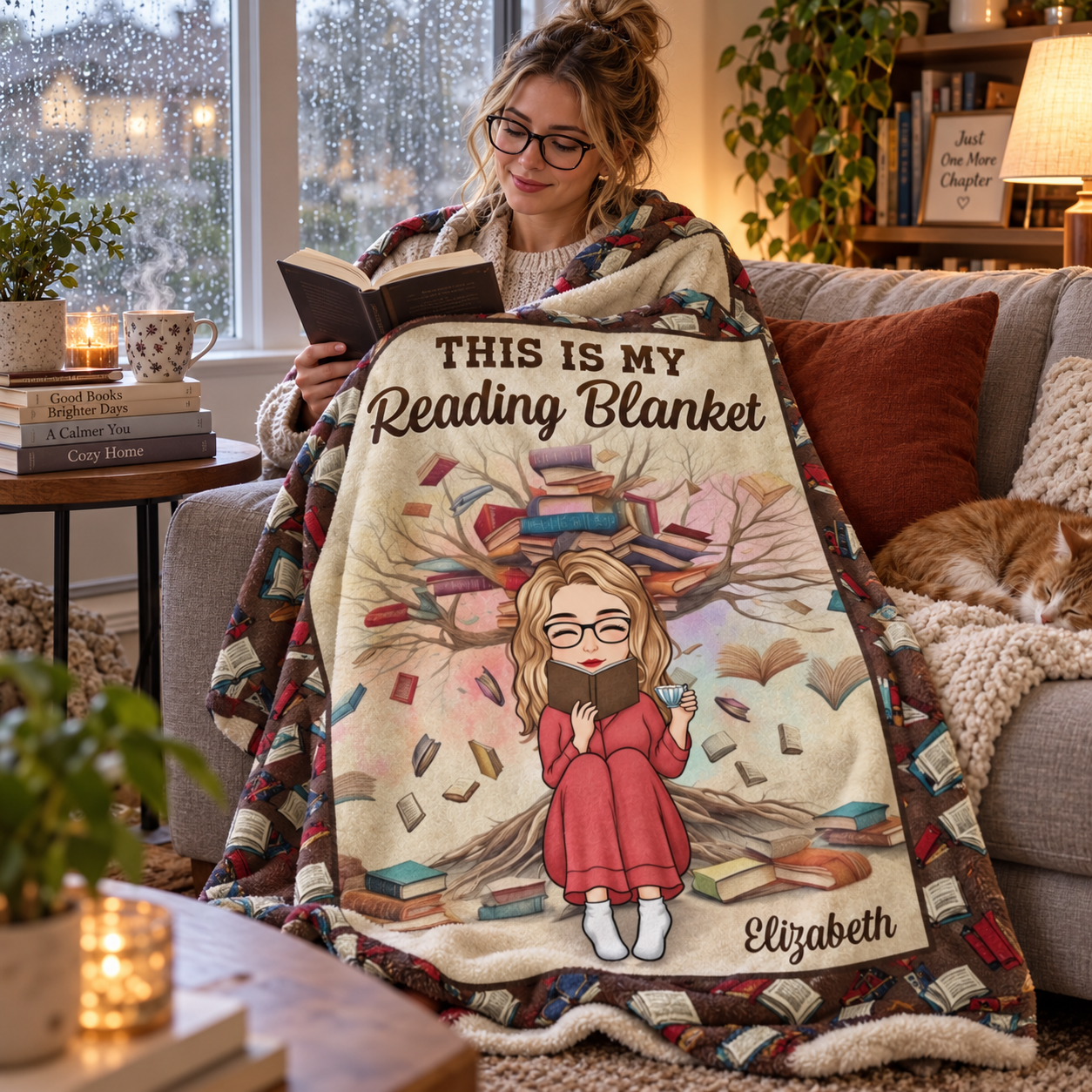 Woman reading a book on a sofa wrapped in a personalized book lovers reading blanket with tea