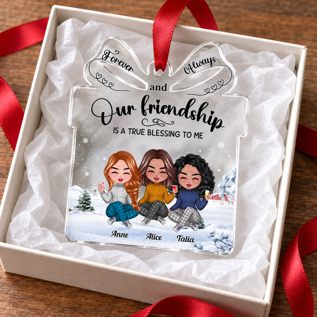 Personalized friendship acrylic ornament in a gift box with tissue and ribbon beside cocoa