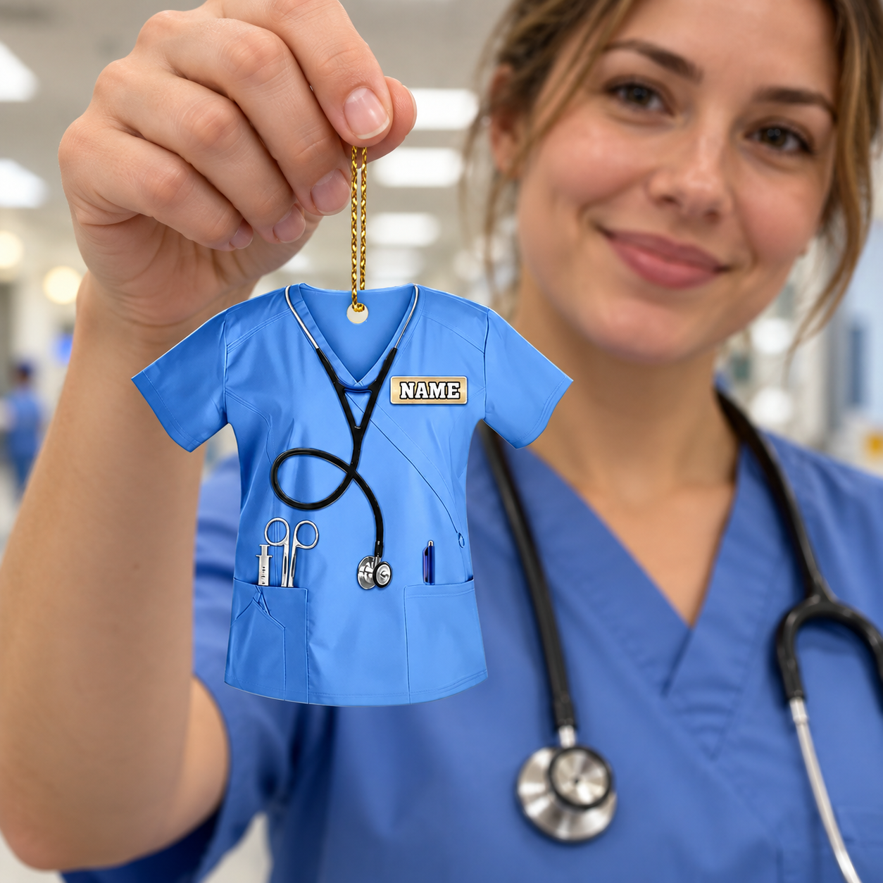 Nurse in scrubs holding a custom name scrubs acrylic ornament in a hospital corridor