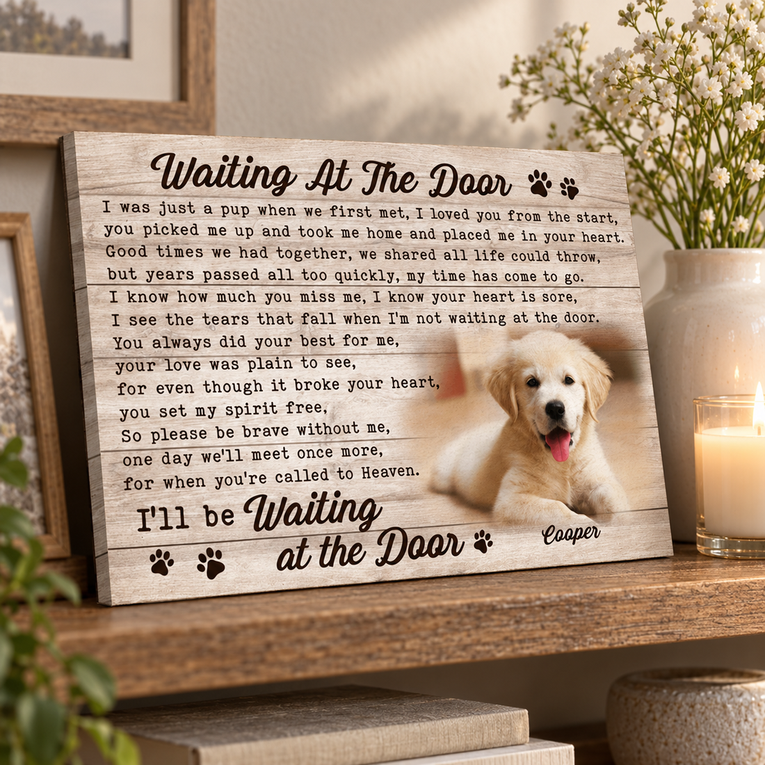 Pet memorial canvas leaning on a shelf with white flowers and a candle as a sympathy gift