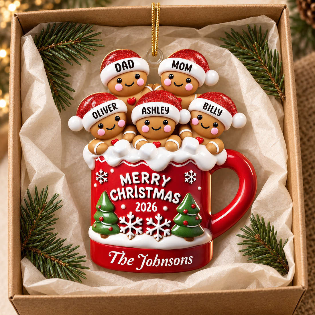 Custom gingerbread family cocoa mug Christmas ornament in a kraft gift box with tissue and pine sprigs