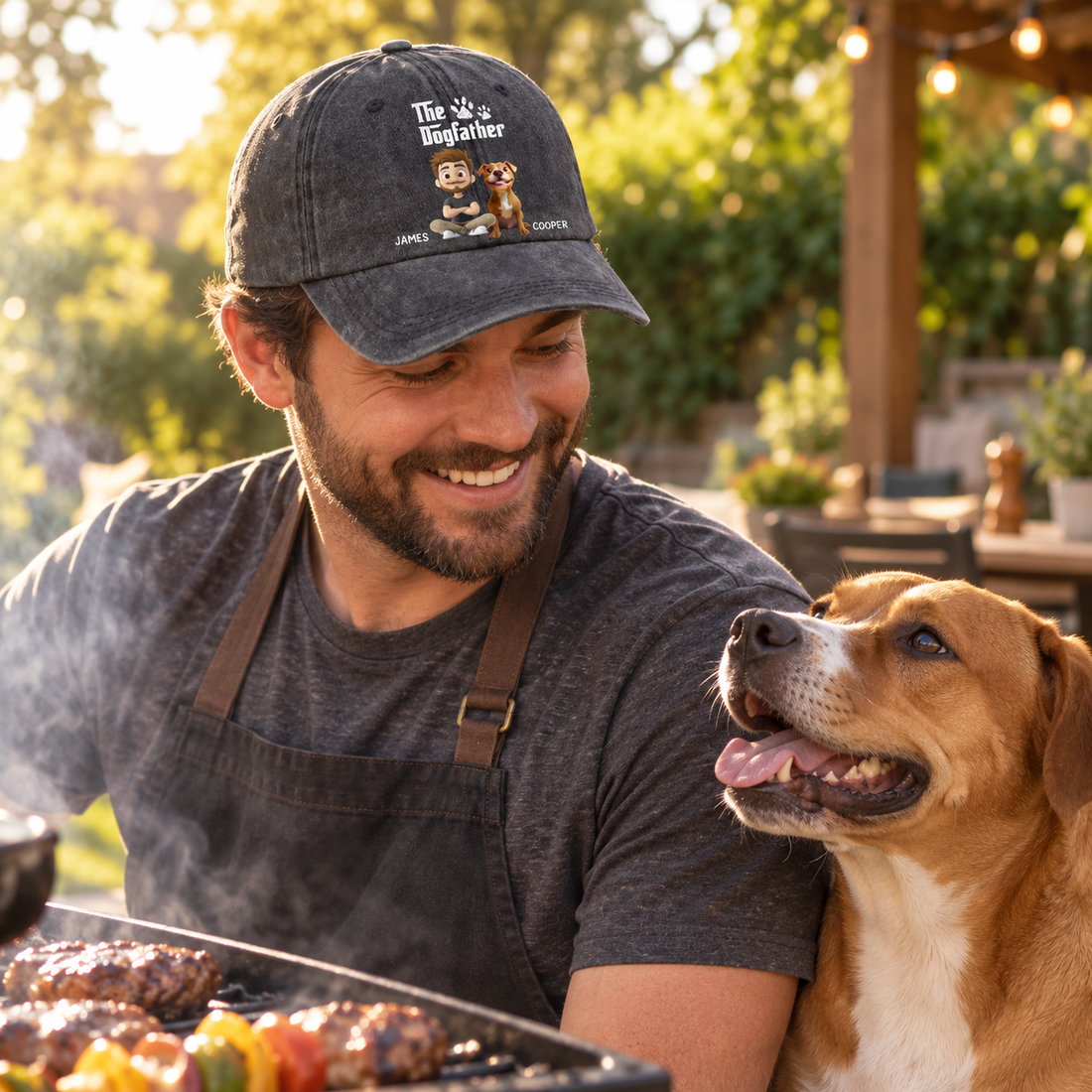 Personalized The Dogfather denim cap worn by a dog dad grilling with his dog