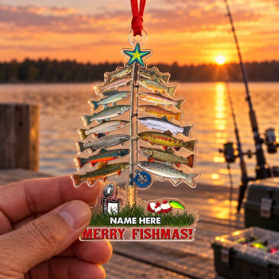Custom Merry Fishmas fishing ornament held in hand at a lake dock at sunset