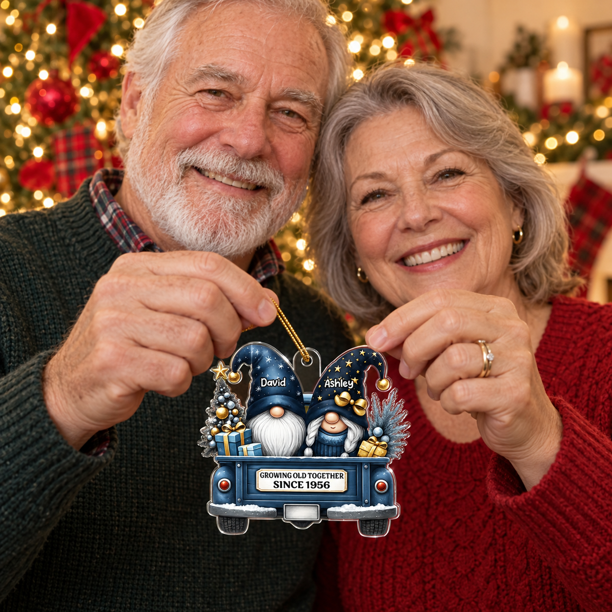 Older couple holding a personalized Growing Old Together gnome ornament by the Christmas tree