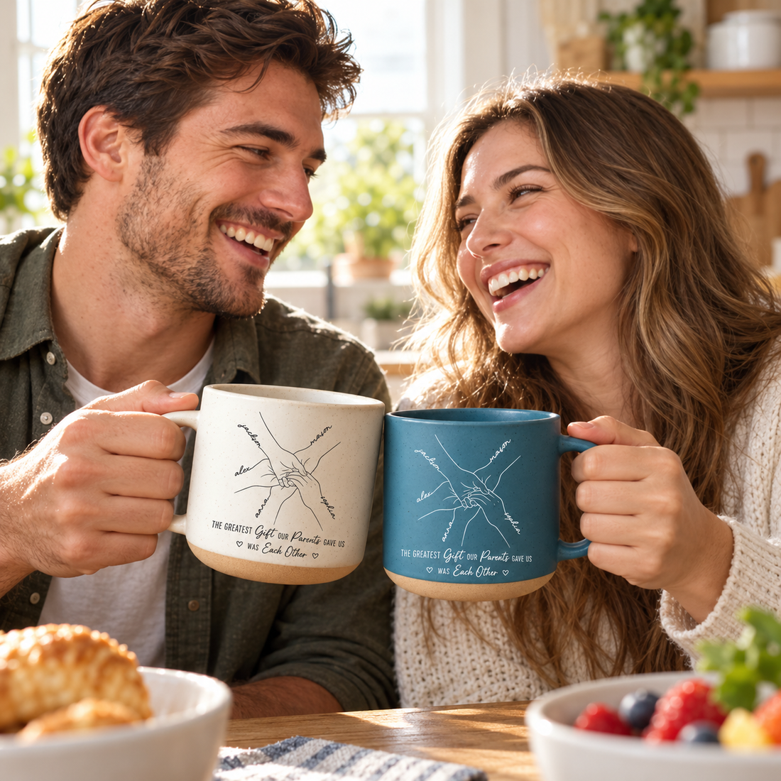 Brother and sister laughing with custom line art hands pottery mugs in a sunny kitchen