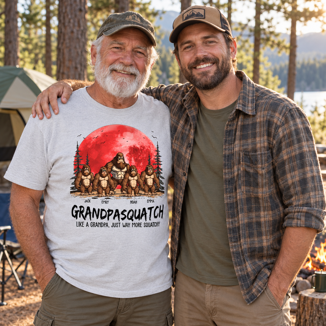 Grandpa wearing the personalized Grandpasquatch t-shirt with his son at a forest campsite