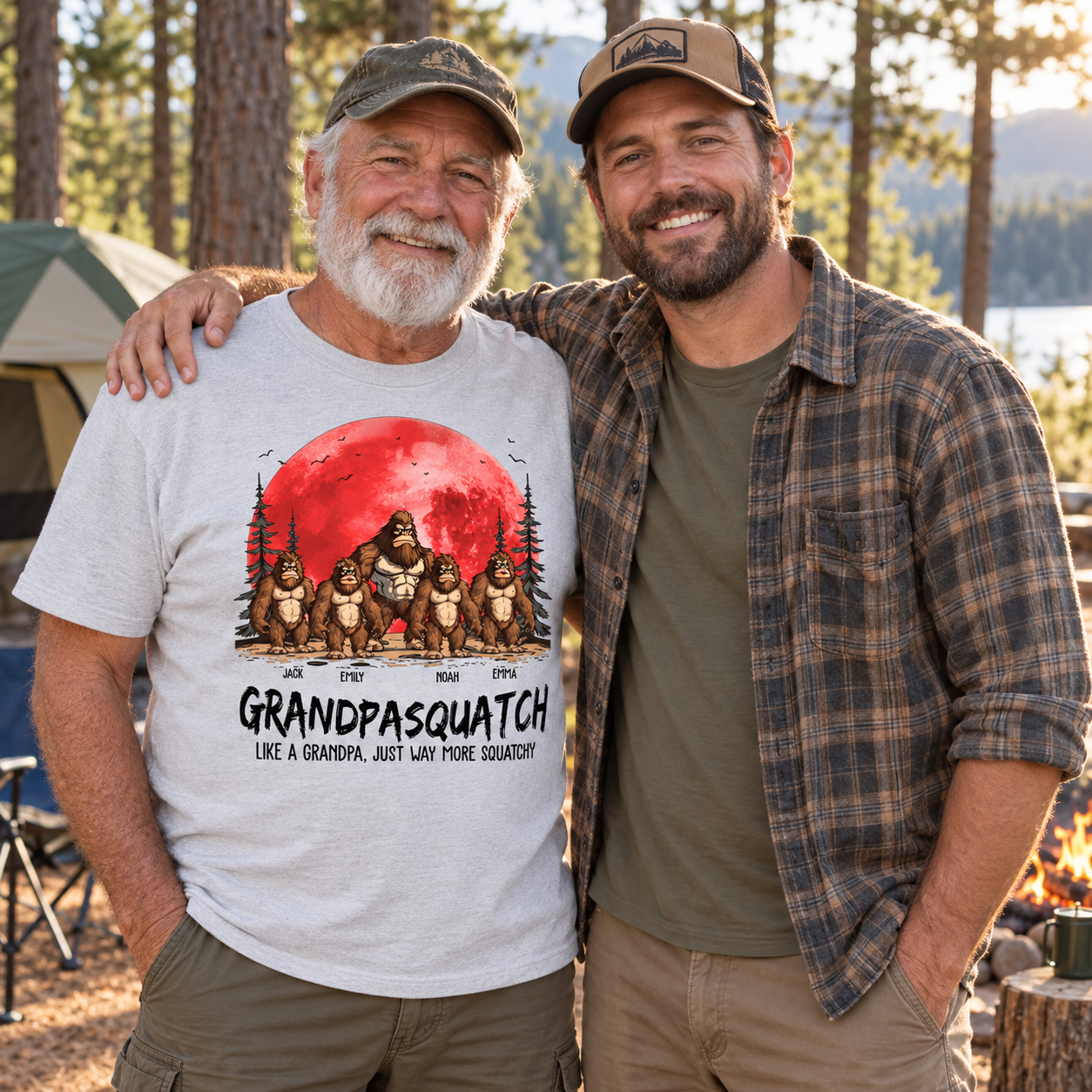 Grandpa wearing the personalized Grandpasquatch t-shirt with his son at a forest campsite