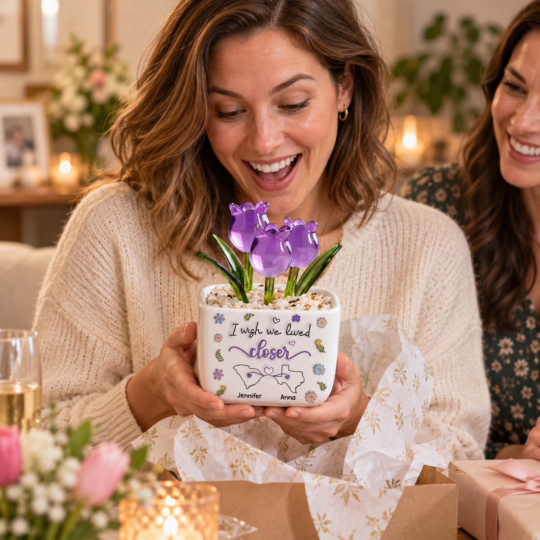 Woman happily unwrapping a personalized glass tulips pot gift from a friend