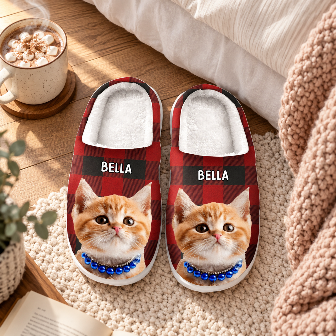 Custom cat photo red plaid slippers with name on a bedroom rug beside hot cocoa