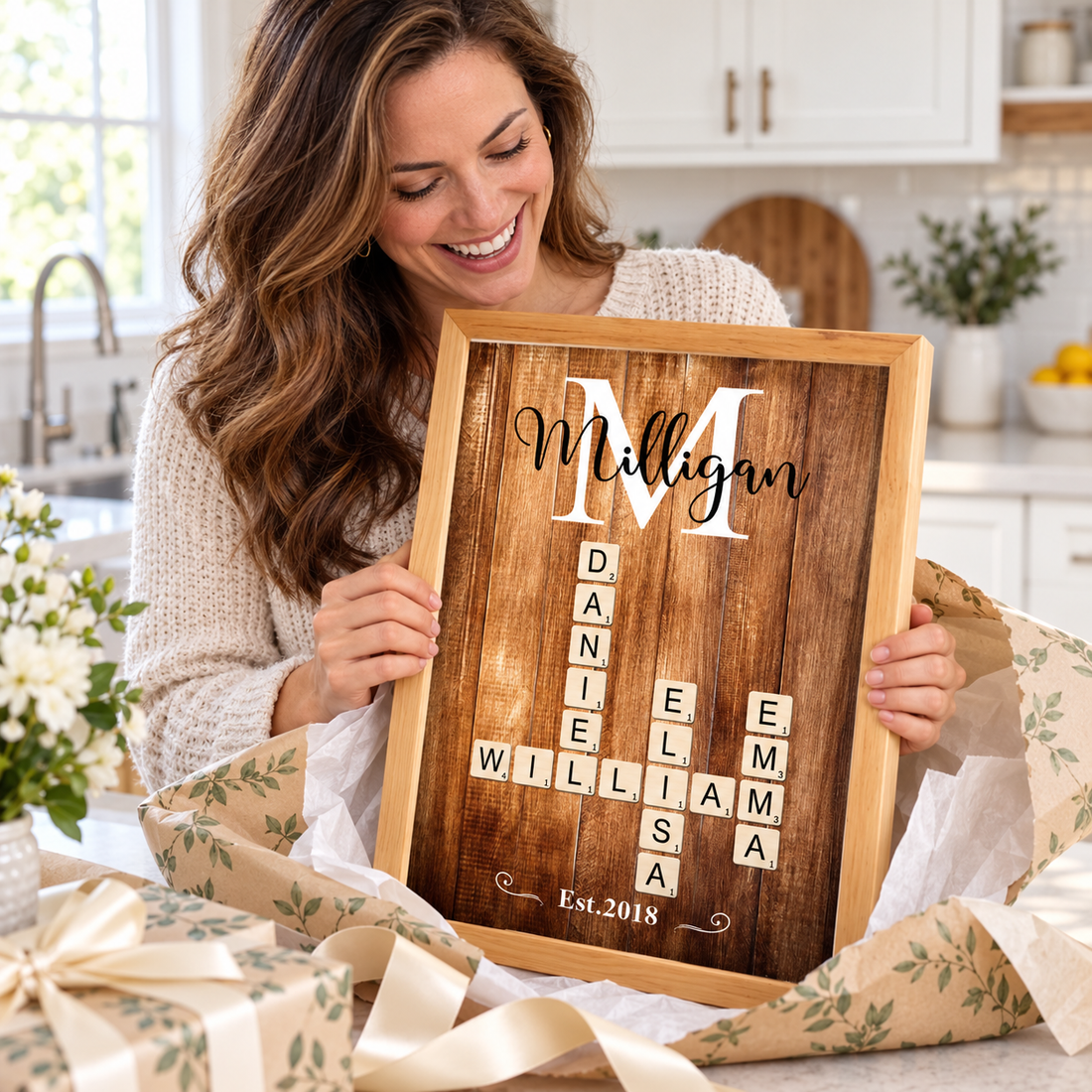 Mother unwrapping a personalized family name crossword art print in a bright kitchen