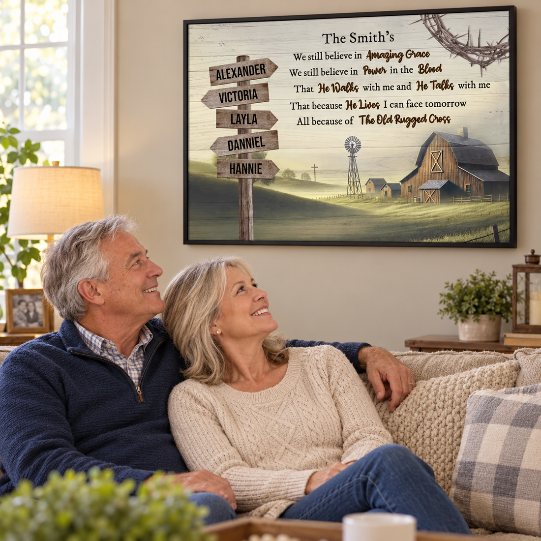 Older couple smiling at their Amazing Grace farmhouse family canvas in the living room