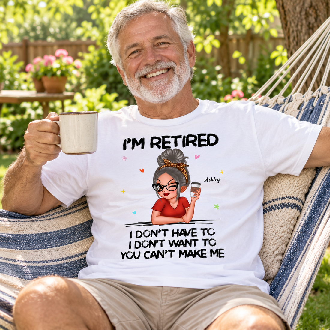 Retired man wearing a funny personalized retirement t-shirt relaxing in a backyard hammock with coffee