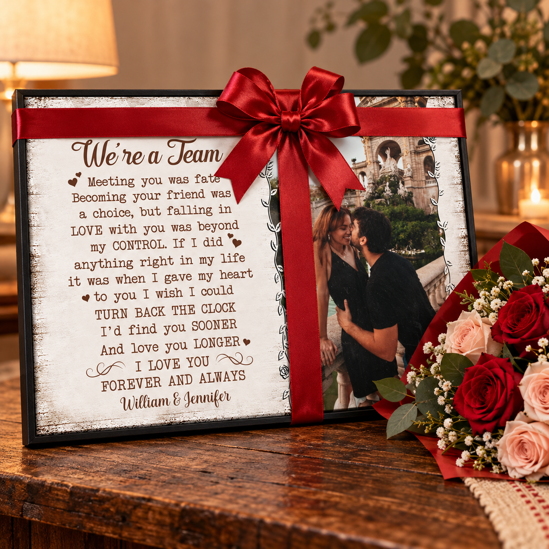 Personalized couple poster wrapped with a ribbon as an anniversary gift beside a bouquet