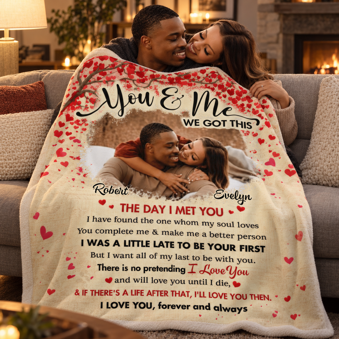 Couple cuddling on a sofa under a custom photo You and Me We Got This blanket in the evening
