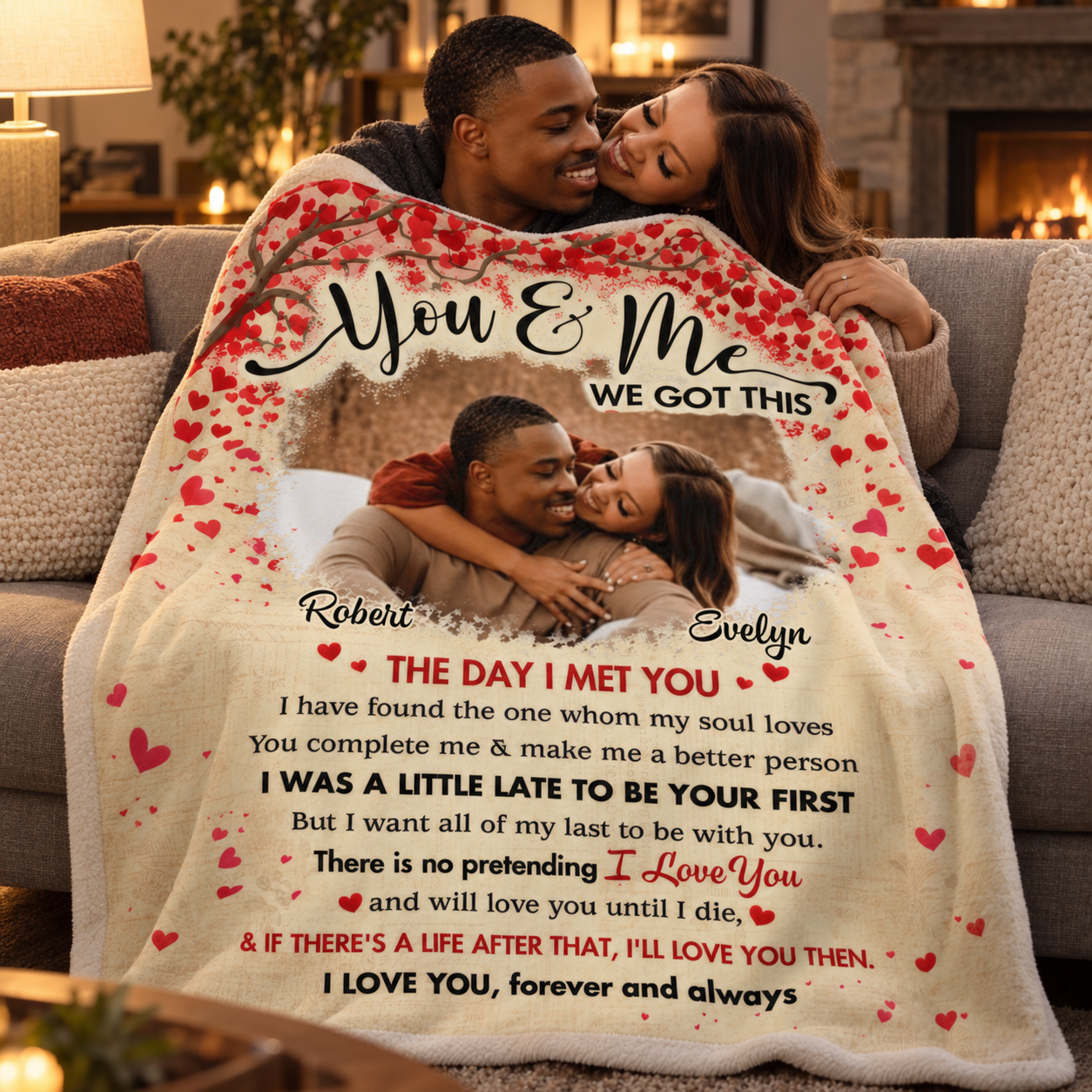 Couple cuddling on a sofa under a custom photo You and Me We Got This blanket in the evening