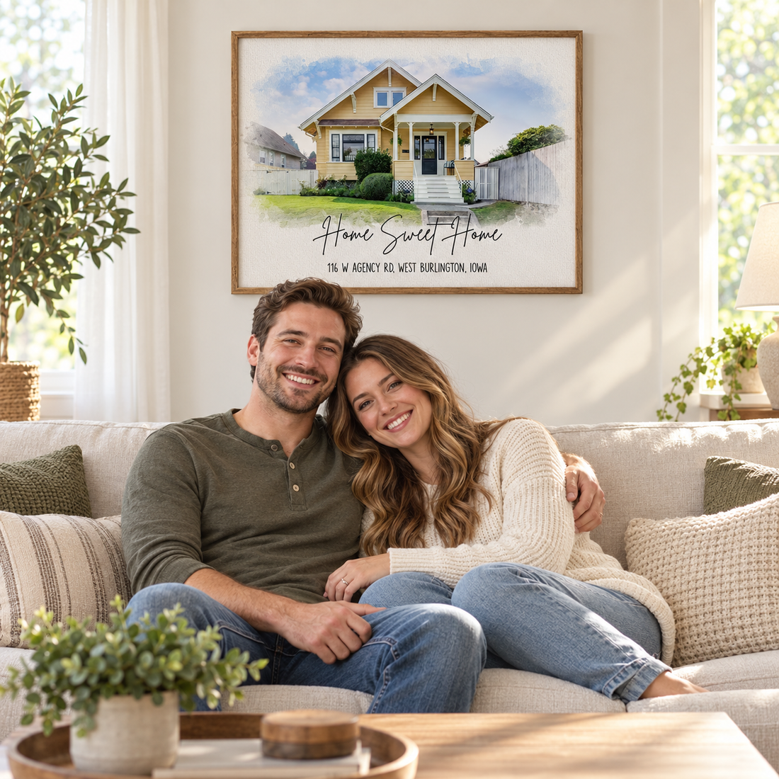 Personalized watercolor house portrait poster Home Sweet Home above a sofa with a smiling couple