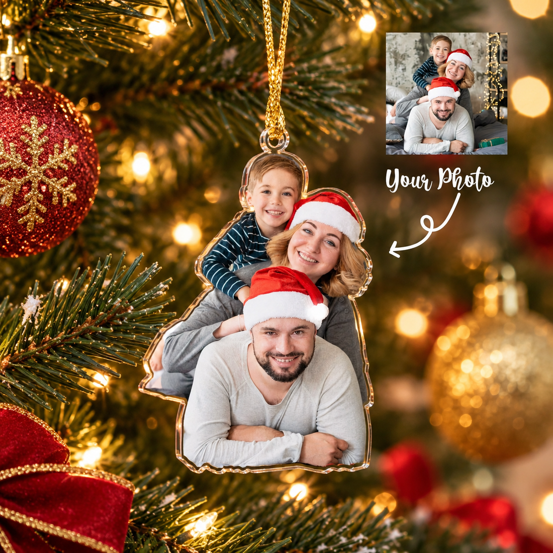 Custom family photo acrylic Christmas ornament with Santa hats on a lit tree