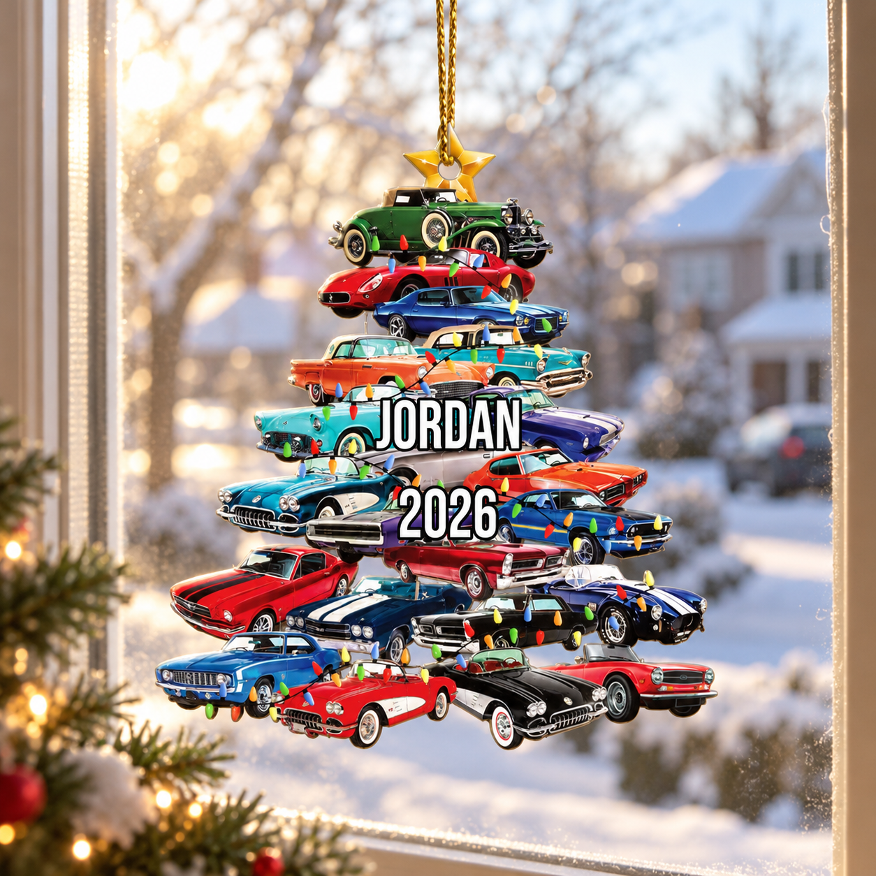 Custom stacked classic cars Christmas tree ornament with name Jordan hanging in a sunny window with snow outside