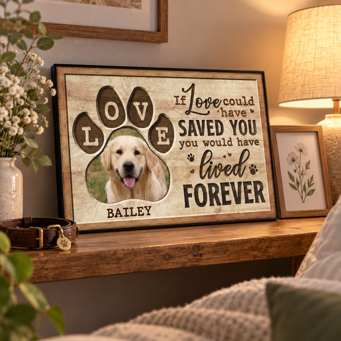 Pet memorial canvas on a shelf beside a dog collar and flowers, a sympathy gift for pet lovers