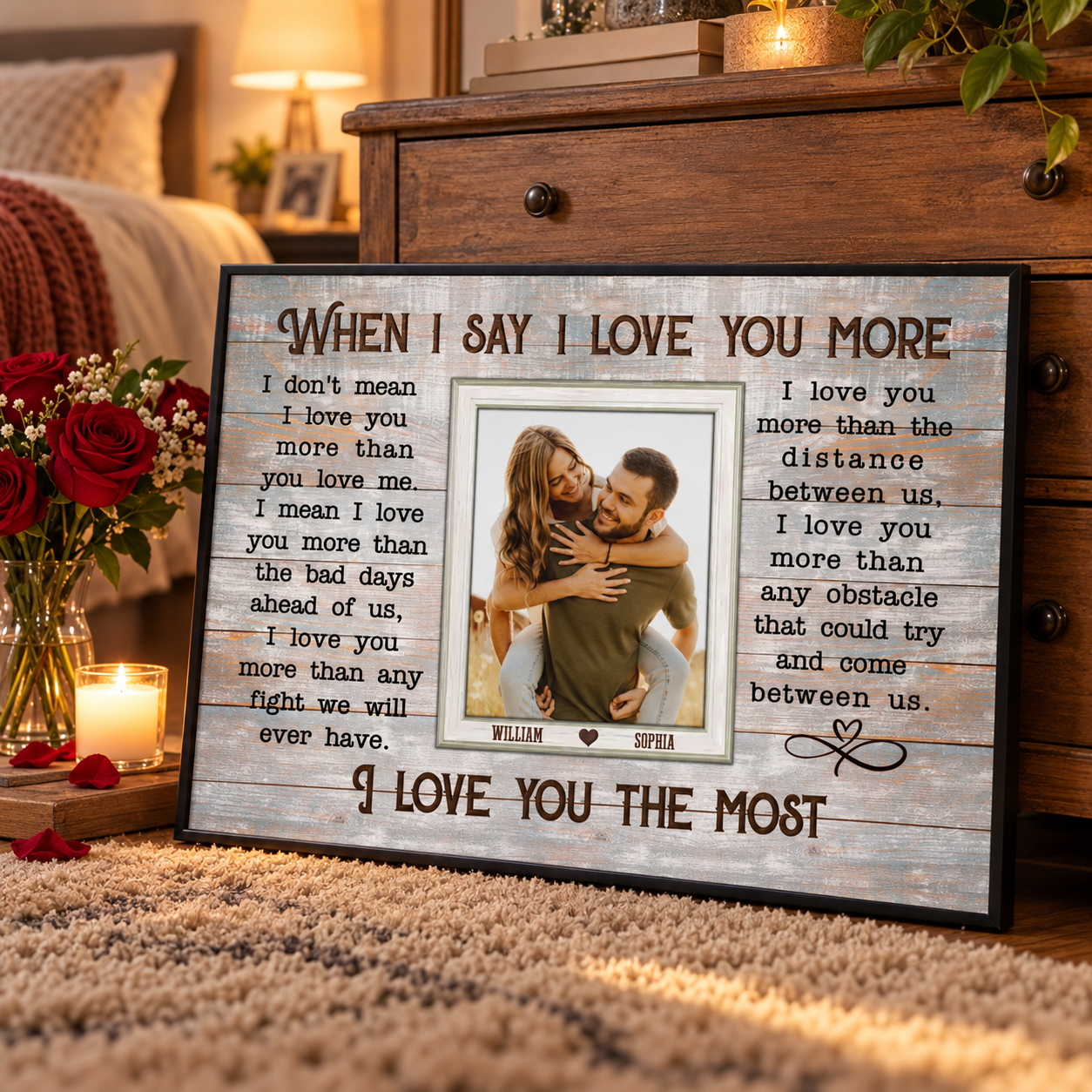 Personalized When I Say I Love You More couple photo poster on a dresser with red roses and a candle