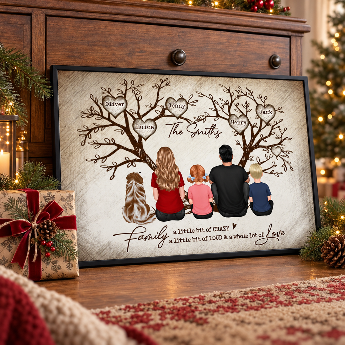 Personalized family tree poster leaning on a dresser beside a Christmas gift and pine branches