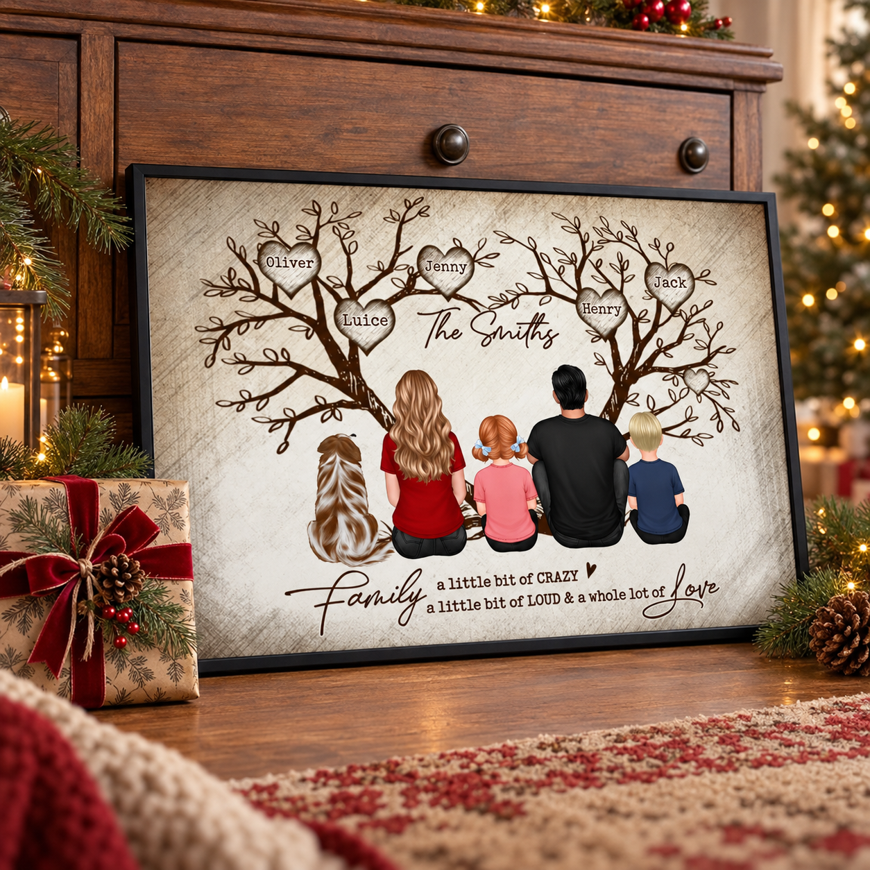 Personalized family tree poster leaning on a dresser beside a Christmas gift and pine branches