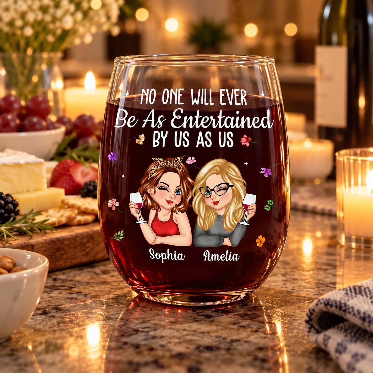 Personalized bestie wine glass on a kitchen counter with a charcuterie board and candles
