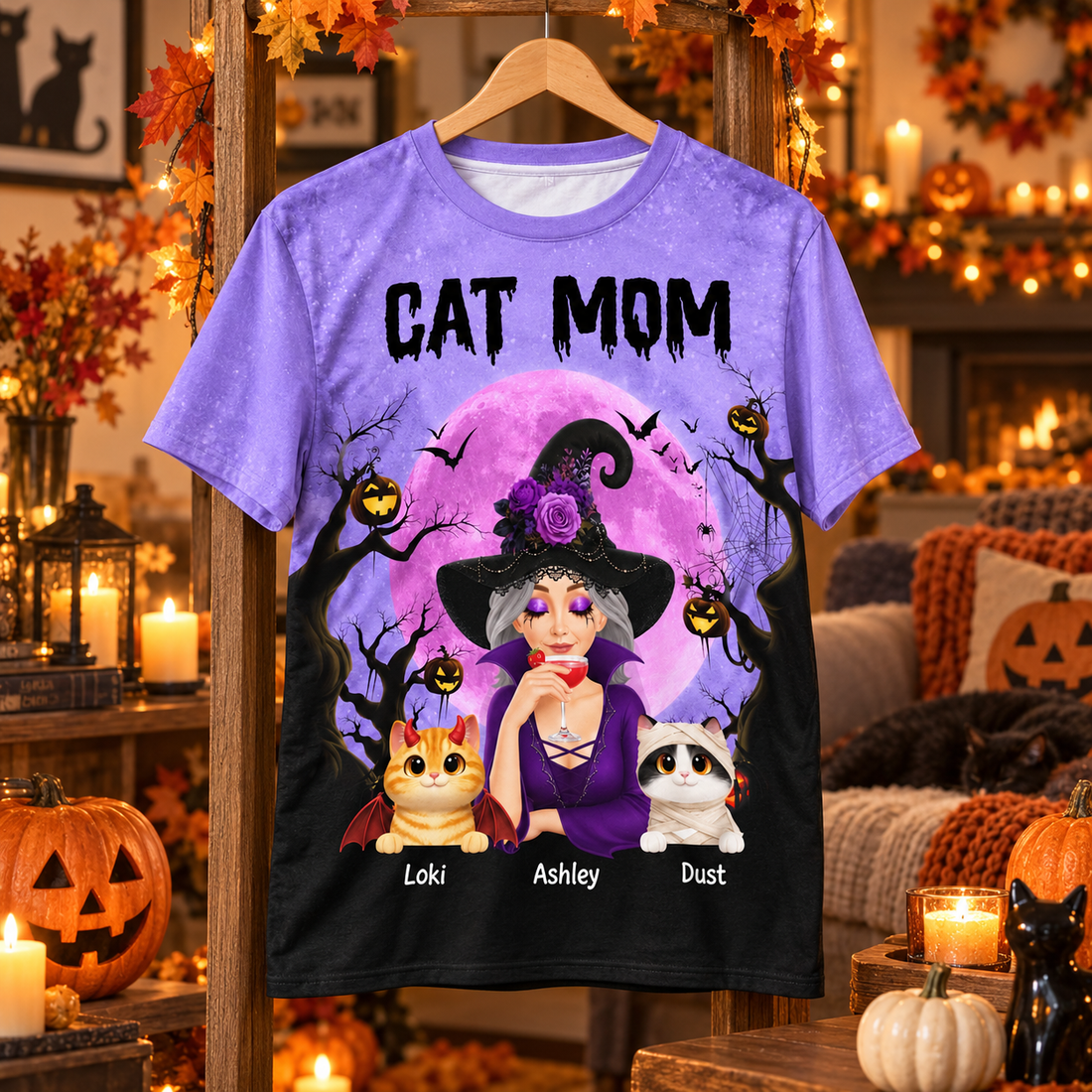 Spooky cat mom witch all-over print t-shirt on a hanger in a Halloween decorated living room