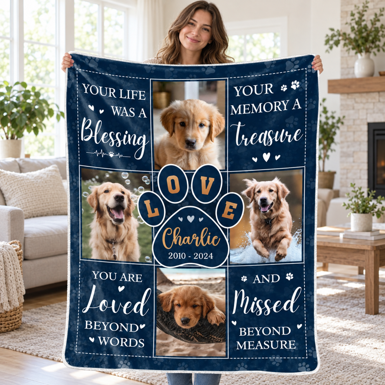 Woman holding up a personalized pet memorial photo blanket with dog photos and name Charlie in a bright living room