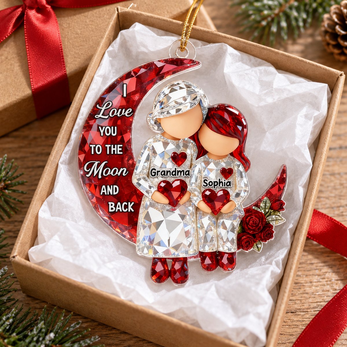 Personalized Grandma and grandkid moon acrylic ornament in a Christmas gift box with red ribbon