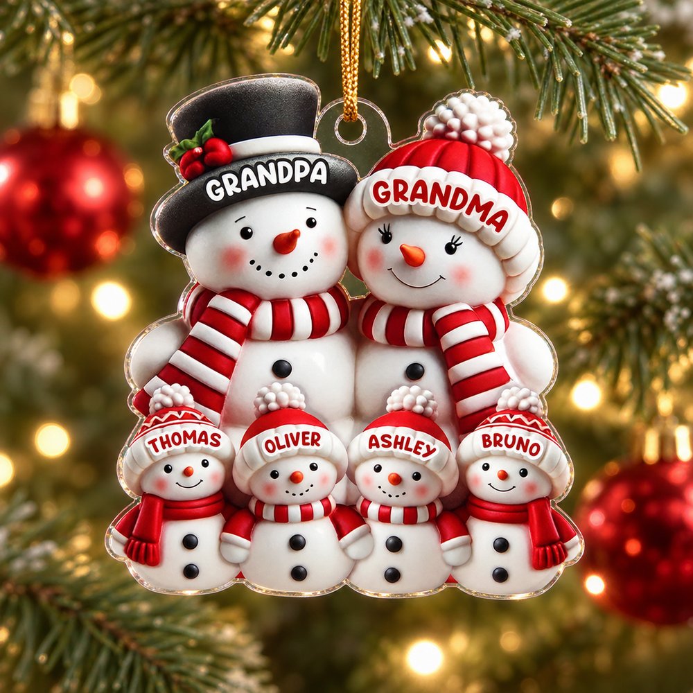Personalized snowman family acrylic ornament hanging on a Christmas tree branch