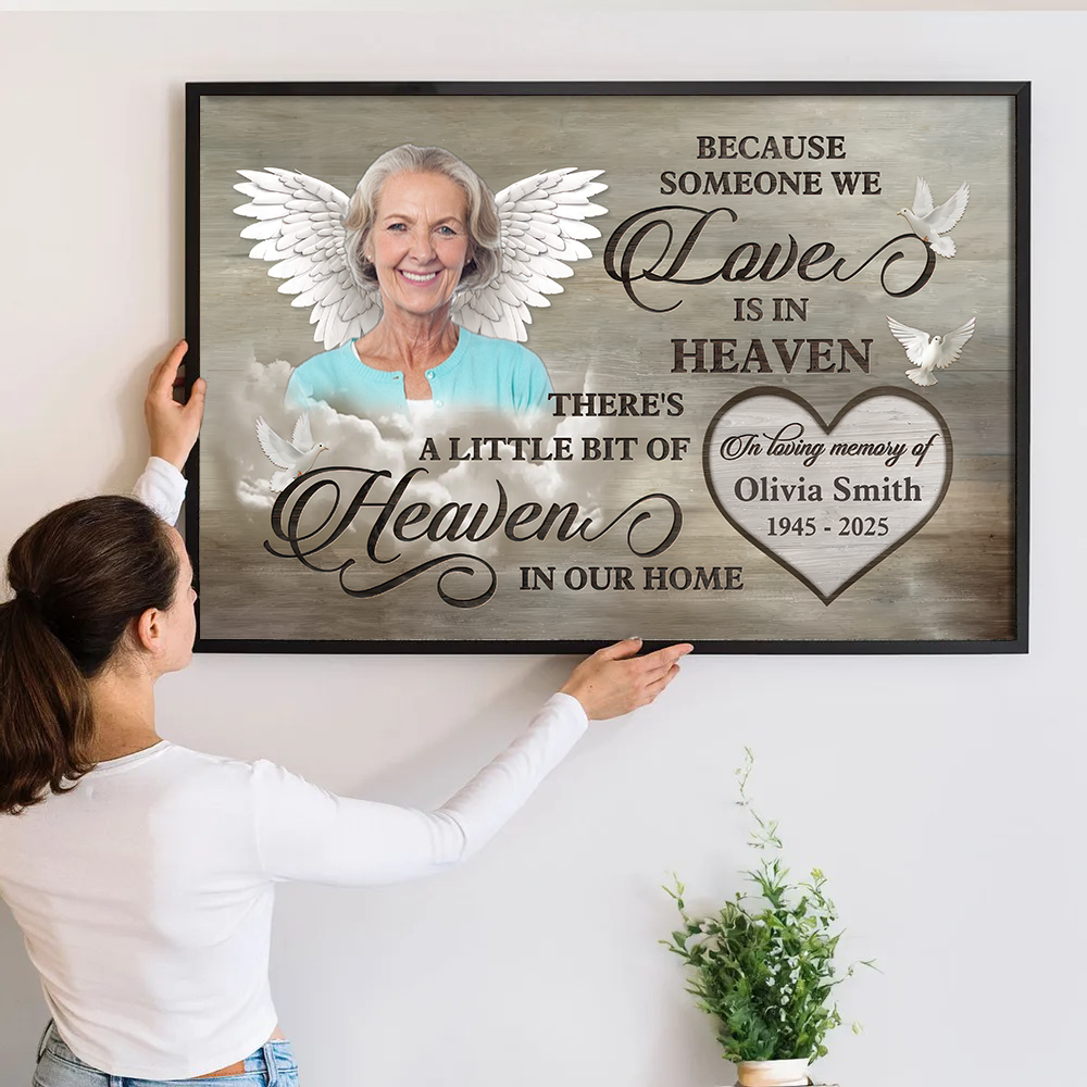 Personalized Custom Photo Love Is In Heaven Loss Of Mom canvas print, a woman hanging the framed print on a wall