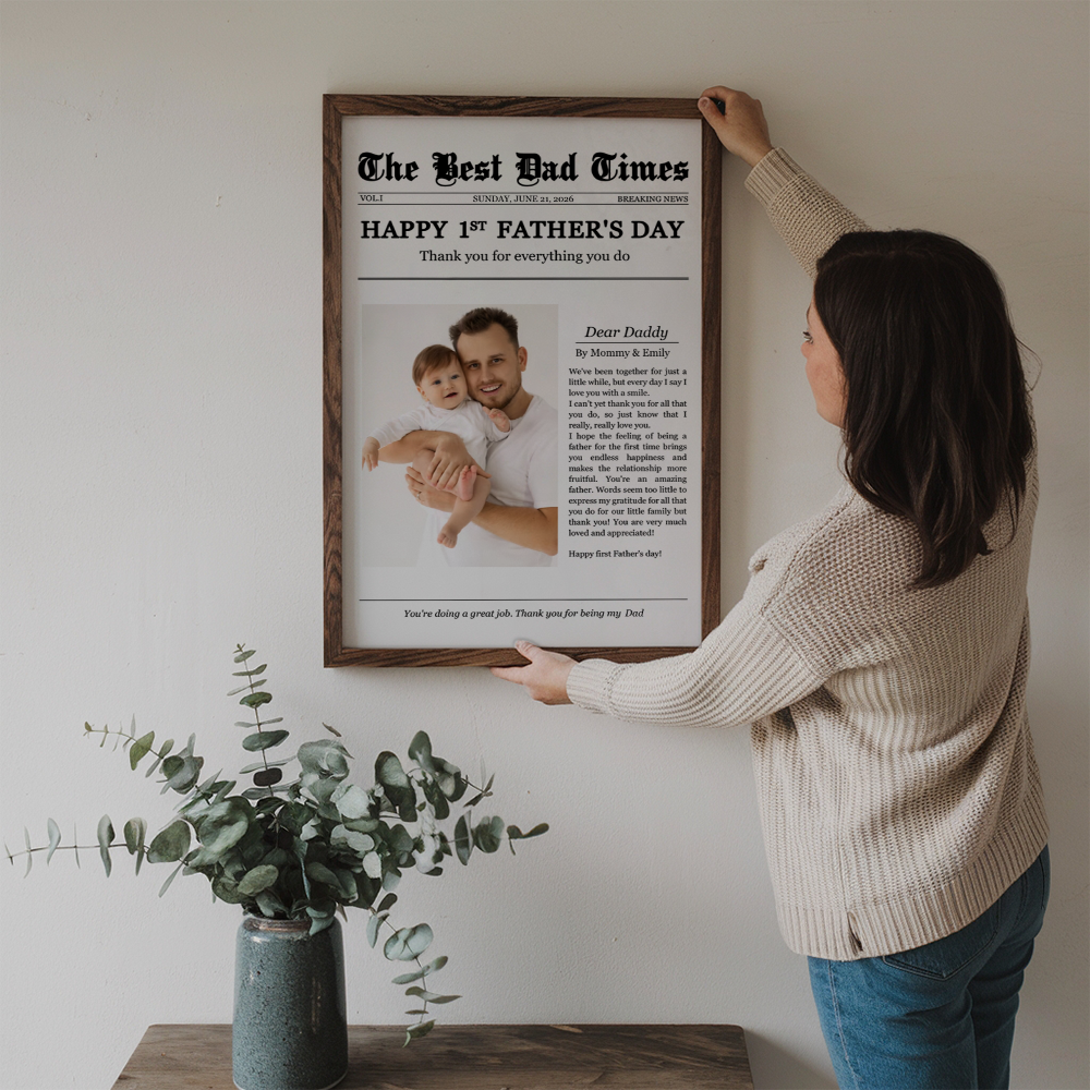 Personalized Happy 1st Father's Day Thank You For Everything poster, a woman hanging the framed print on a wall