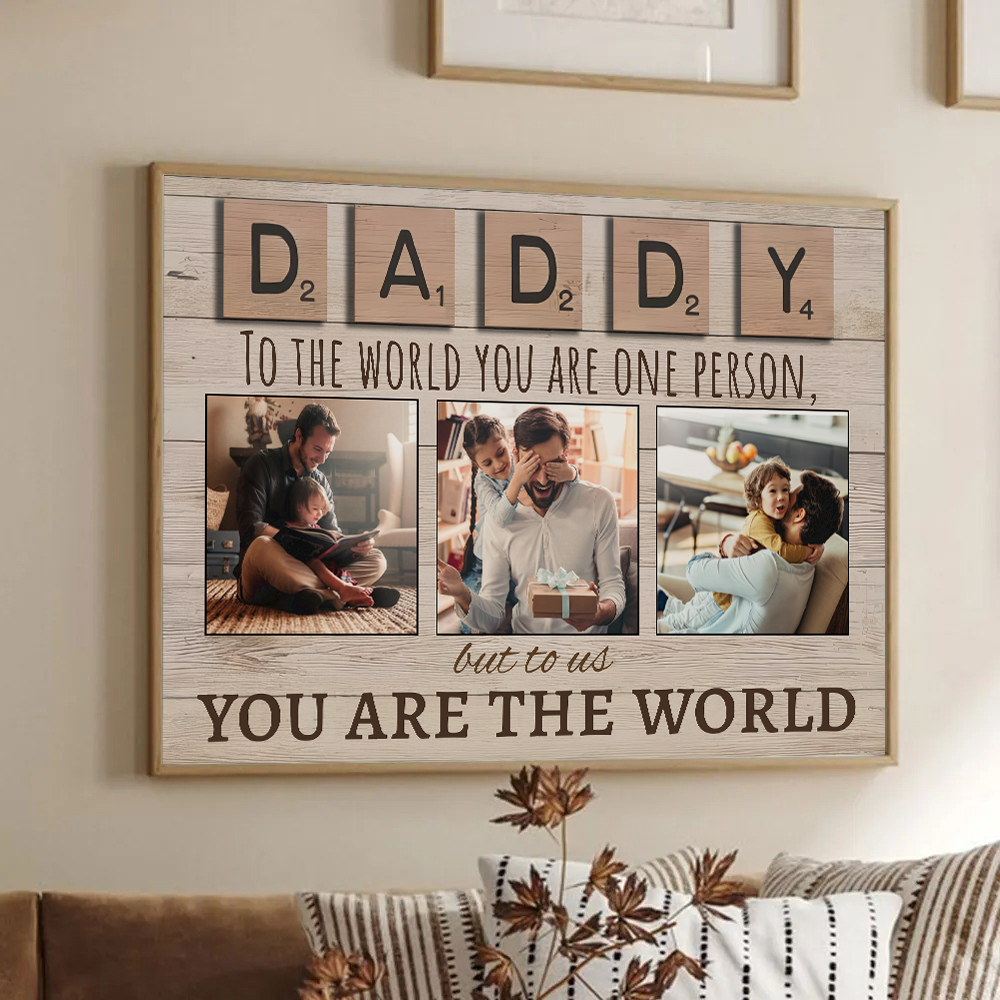 Personalized Daddy To The World You Are One Person But To Us You Are The World poster, framed in a bright living room