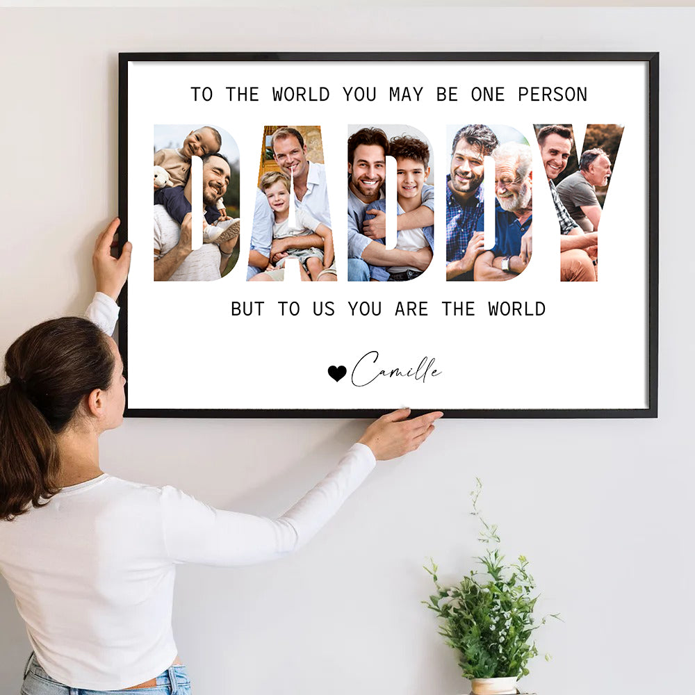 Custom Photo Daddy Photo Collage poster, a woman hanging the framed print on a wall
