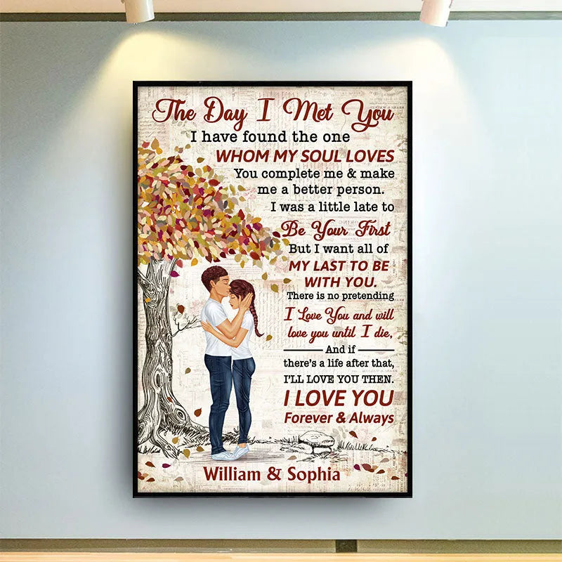 Personalized The Day I Met You canvas print, a woman hanging the framed print on a wall