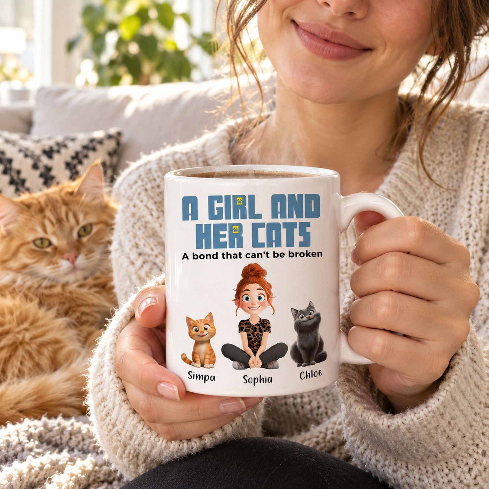 Woman holding personalized girl and her cats ceramic coffee mug on sofa with cat