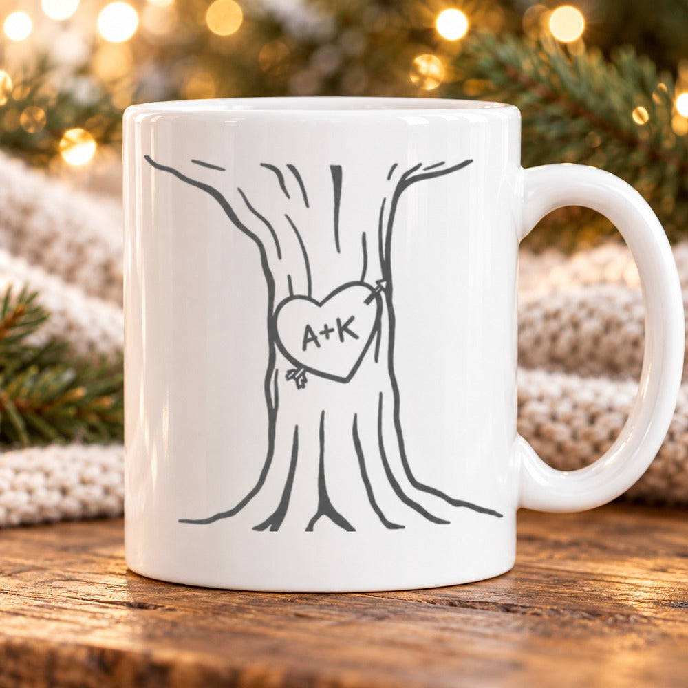 Personalized heart tree couple mug on wooden table with festive holiday greenery
