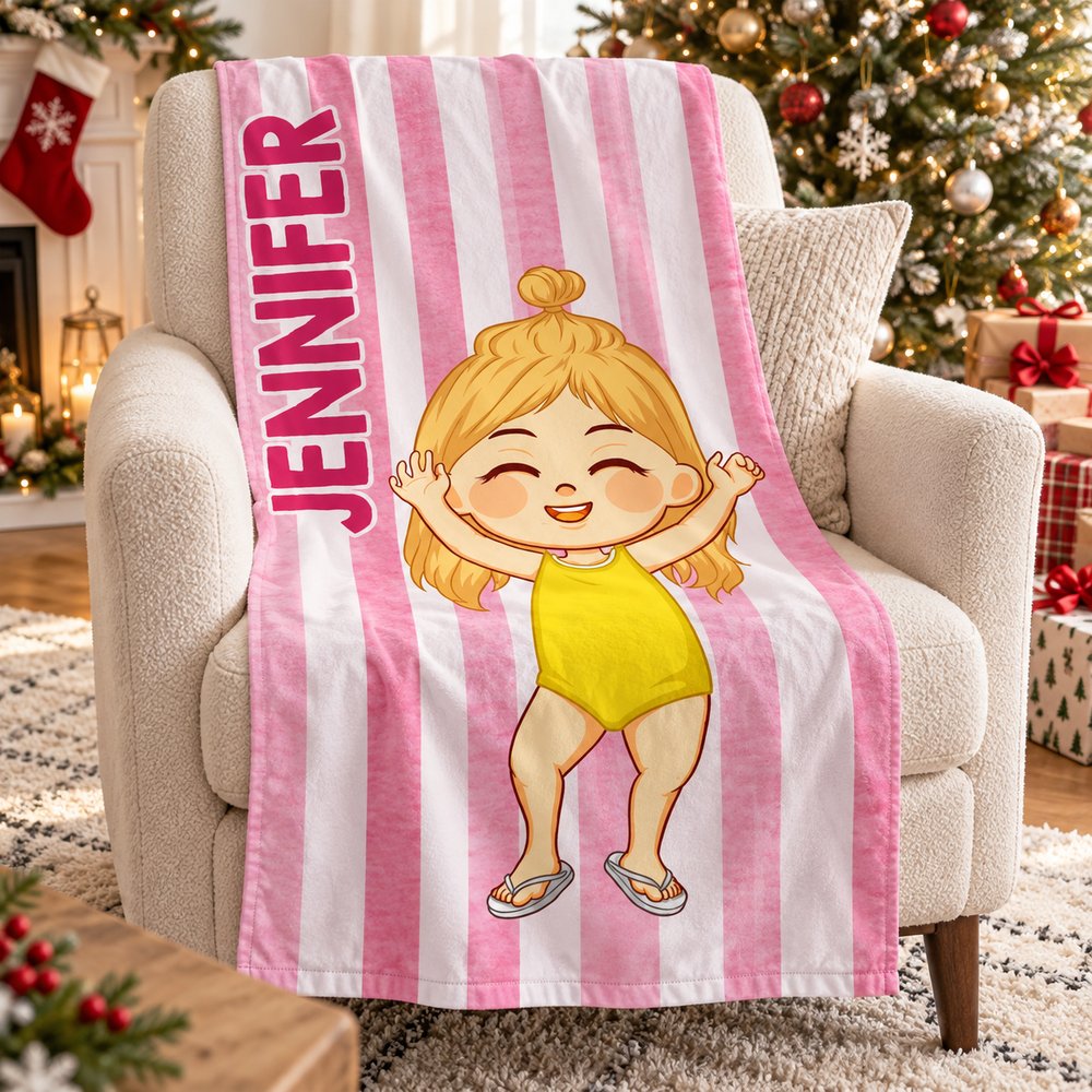 Personalized kids beach towel displayed on a living room armchair next to a Christmas tree