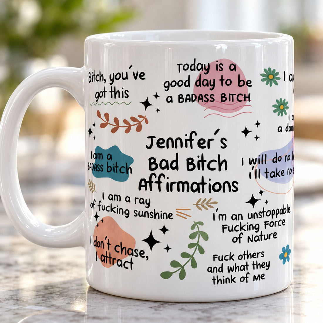 Close-up detail of glossy ceramic mug print showing Bad Bitch Affirmations text and pastel art
