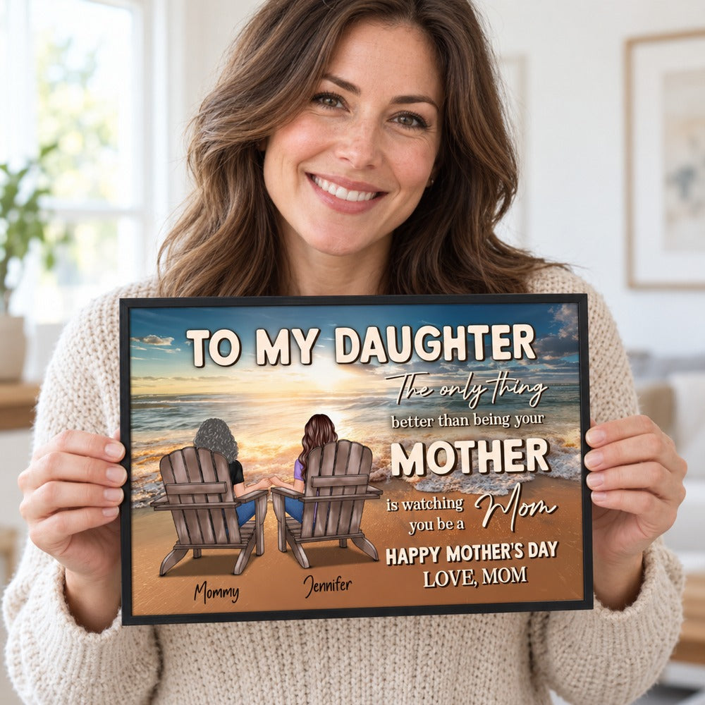 Adult daughter smiling while holding her personalized Mother's Day beach print from Mom