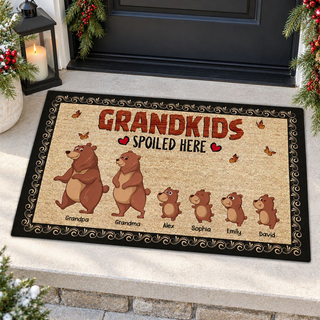 Personalized Bear Grandkids Spoiled Here doormat on a festive holiday front porch with pine garland