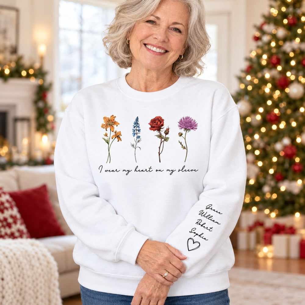 Grandma wearing personalized birth month flowers sleeve printed sweater on Christmas morning