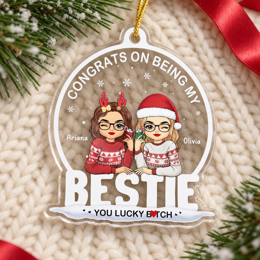 Congrats On Being My Bestie acrylic ornament lying flat on cozy cream knit fabric