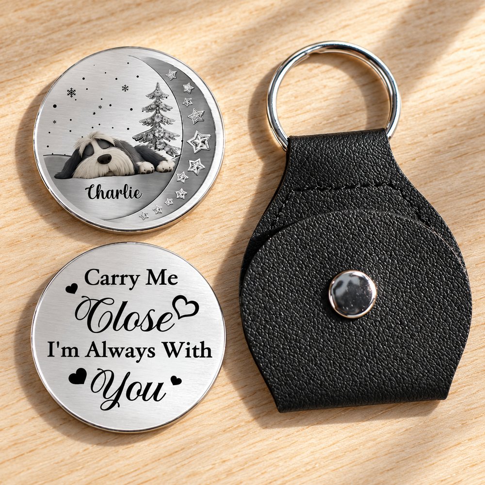 Macro closeup of stainless steel pet memorial pocket hug coin print and pebbled leather pouch