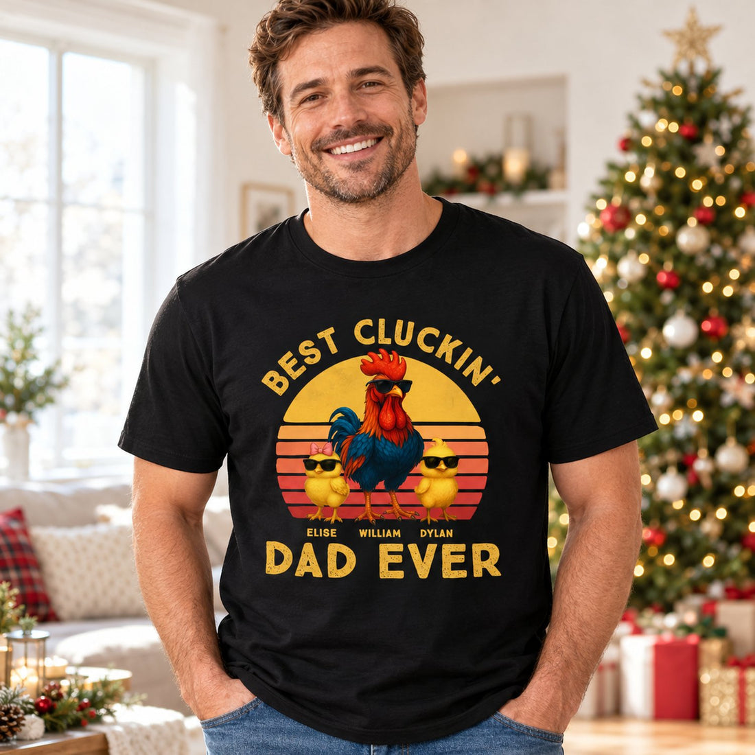 Dad wearing personalized Best Cluckin Dad Ever black t-shirt in a bright holiday living room
